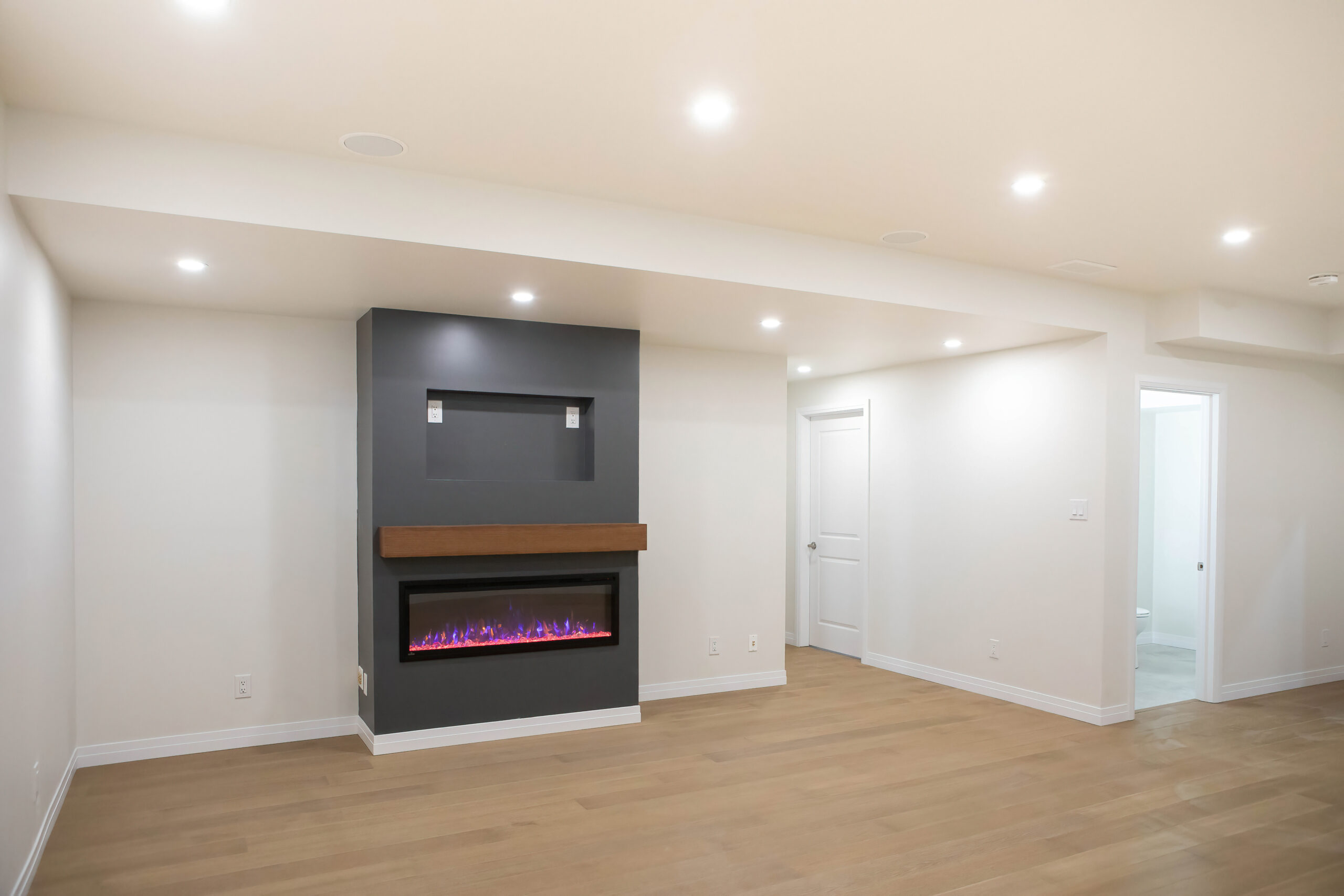 Basement finishing and renovation, custom fireplace and flooring